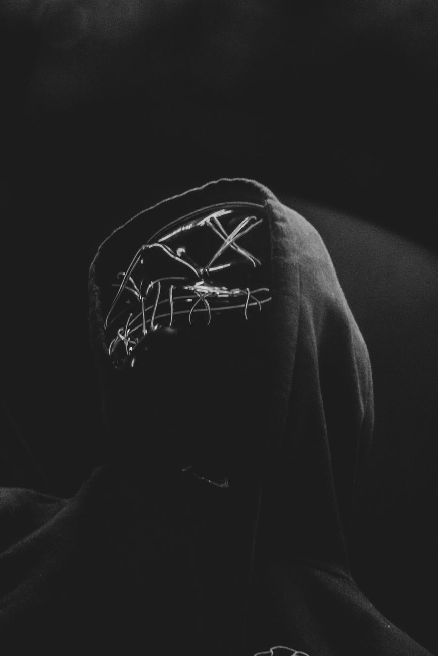 Dark and intriguing portrait of a hooded figure with an eerie vibe, featuring unique style and fashion.. pexels, dark, intrig