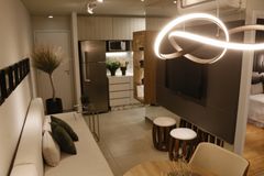 Luxurious modern living room setup featuring elegant lighting and decor.
