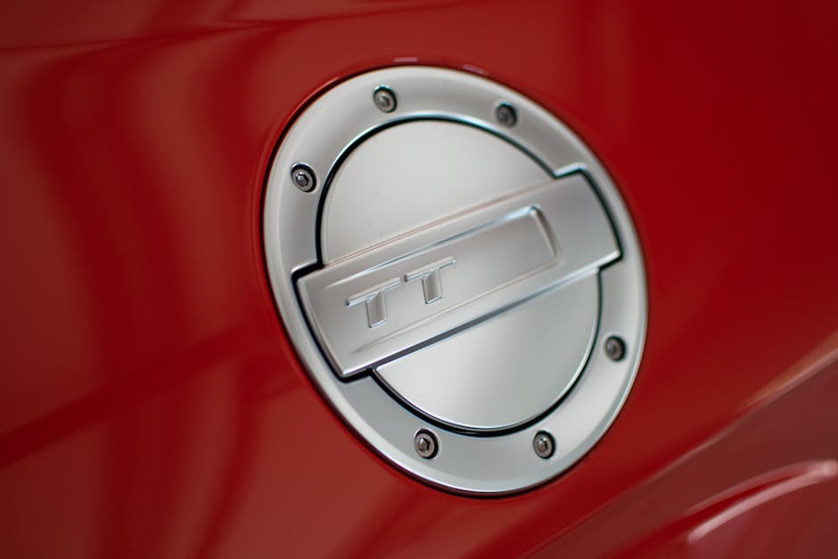 A Gray Fuel Cap of a Red Car