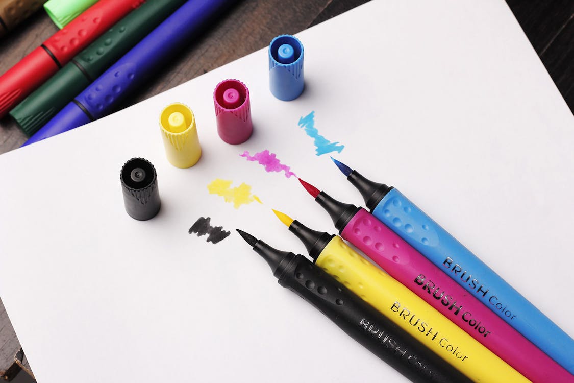 Free Brush Colouring Pens On Top Of White Paper Stock Photo