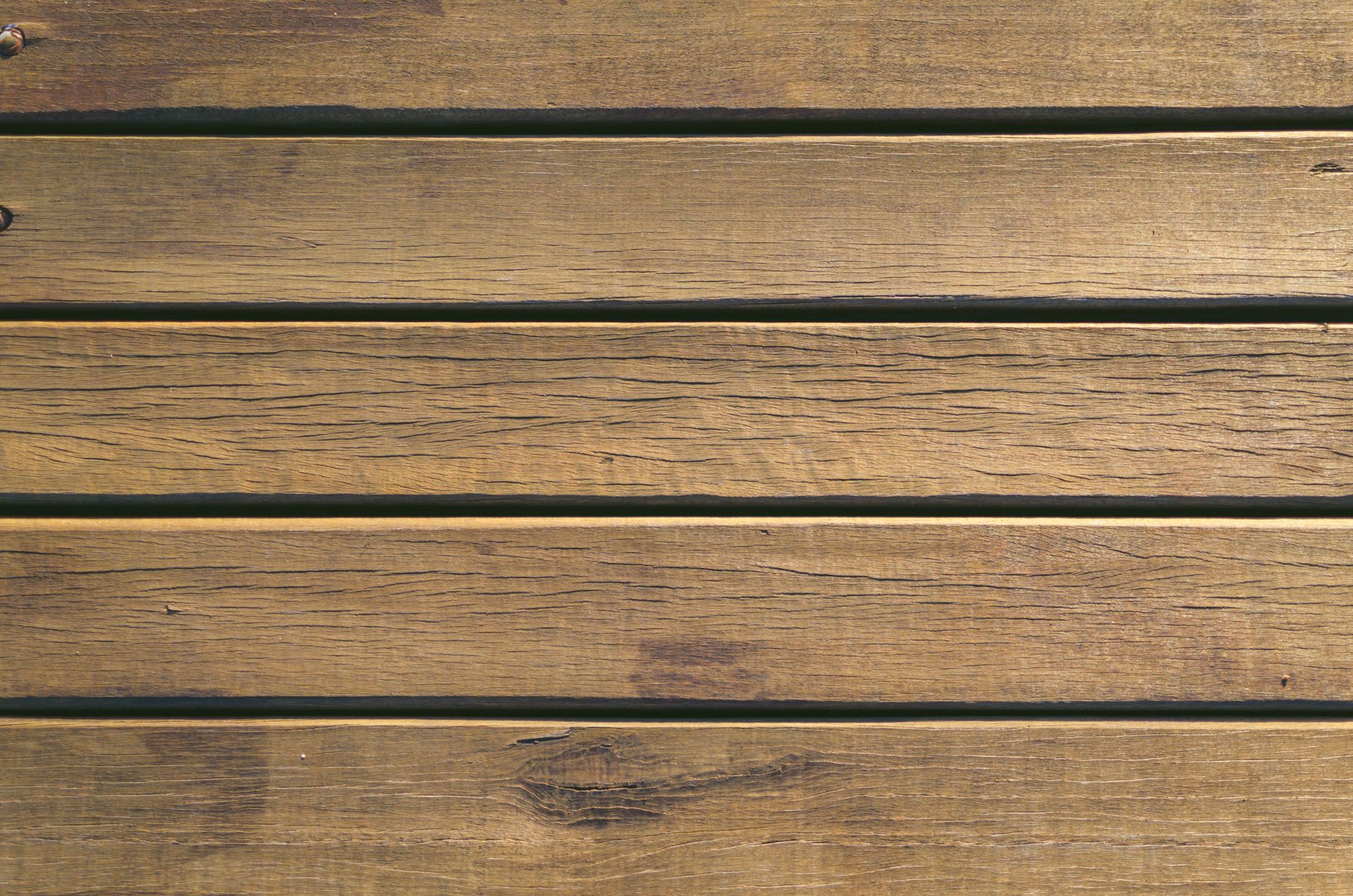 Close-up of rustic wooden planks displaying natural patterns and textures.
