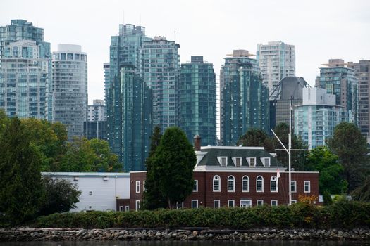 The Vancouver skyline with modern skyscrapers and a historic building in the foreground.