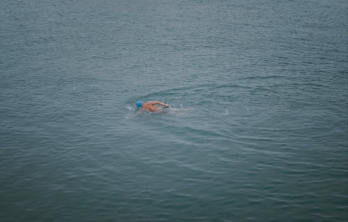 Person Swimming in the Sea