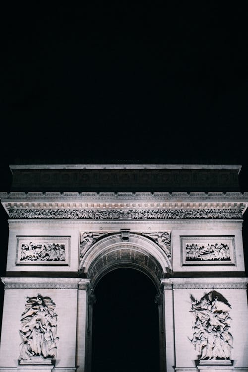 A Gray Concrete Arch in Dark Background