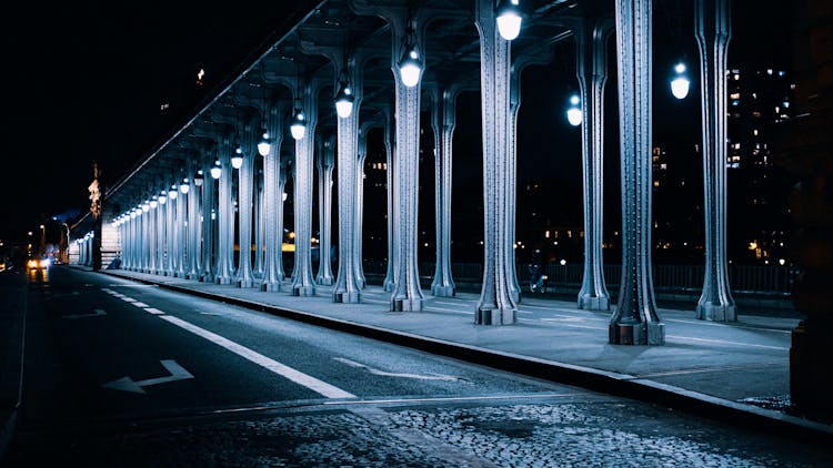 Illuminated Metal Bridge At Night