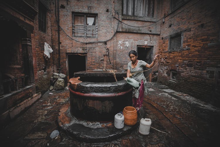 A Woman Fetching Water From Well