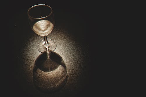 Clear Wine Glass on Black Surface