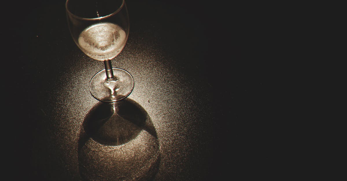 Clear Wine Glass on Black Surface