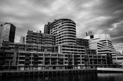 Black and White Photo of a City Building and Sea