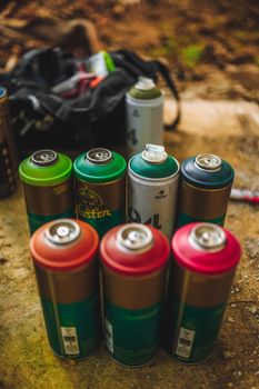 Eight Green and Red Plastic Bottles
