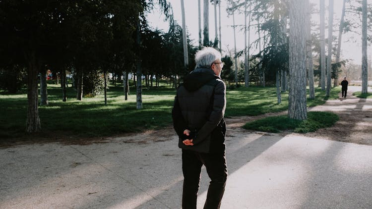 Man Walking In A Park 