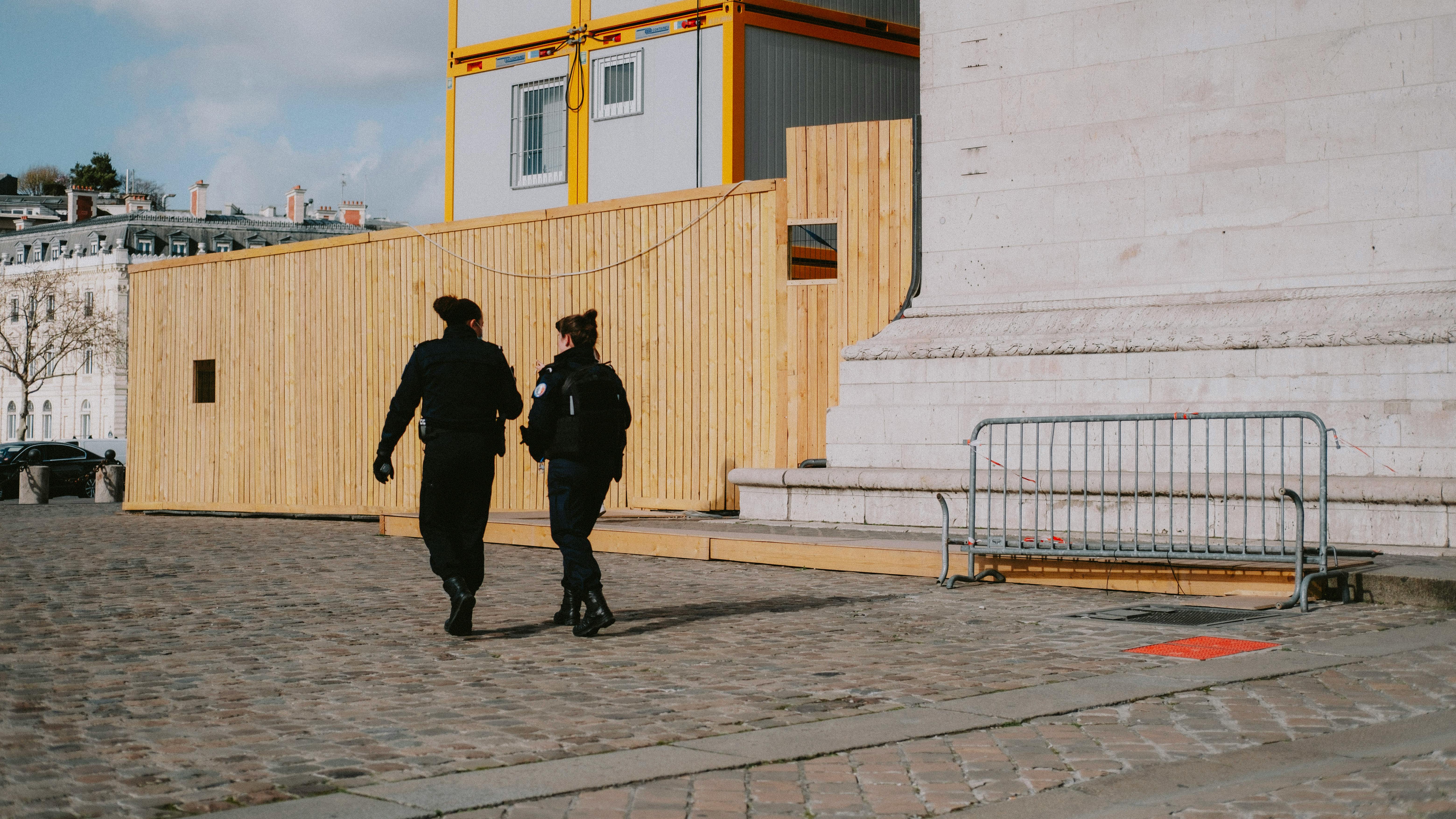 A team of uniformed security officers patrolling a warehouse facility