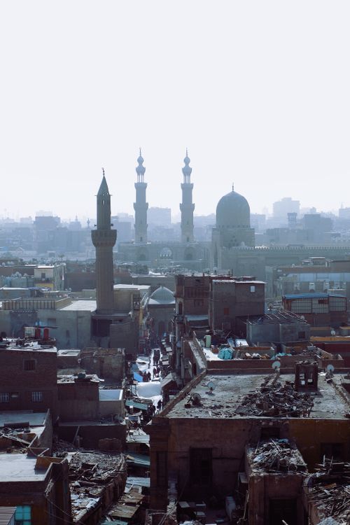 Free A captivating view of Cairo's urban skyline featuring historic minarets and rooftops. Stock Photo