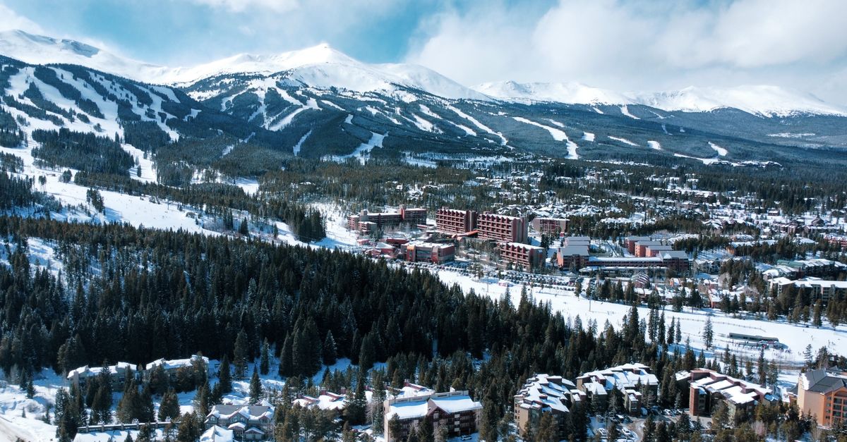 A stunning aerial view of Breckenridge, Colorado, showcasing snow-covered mountains and a winter landscape.