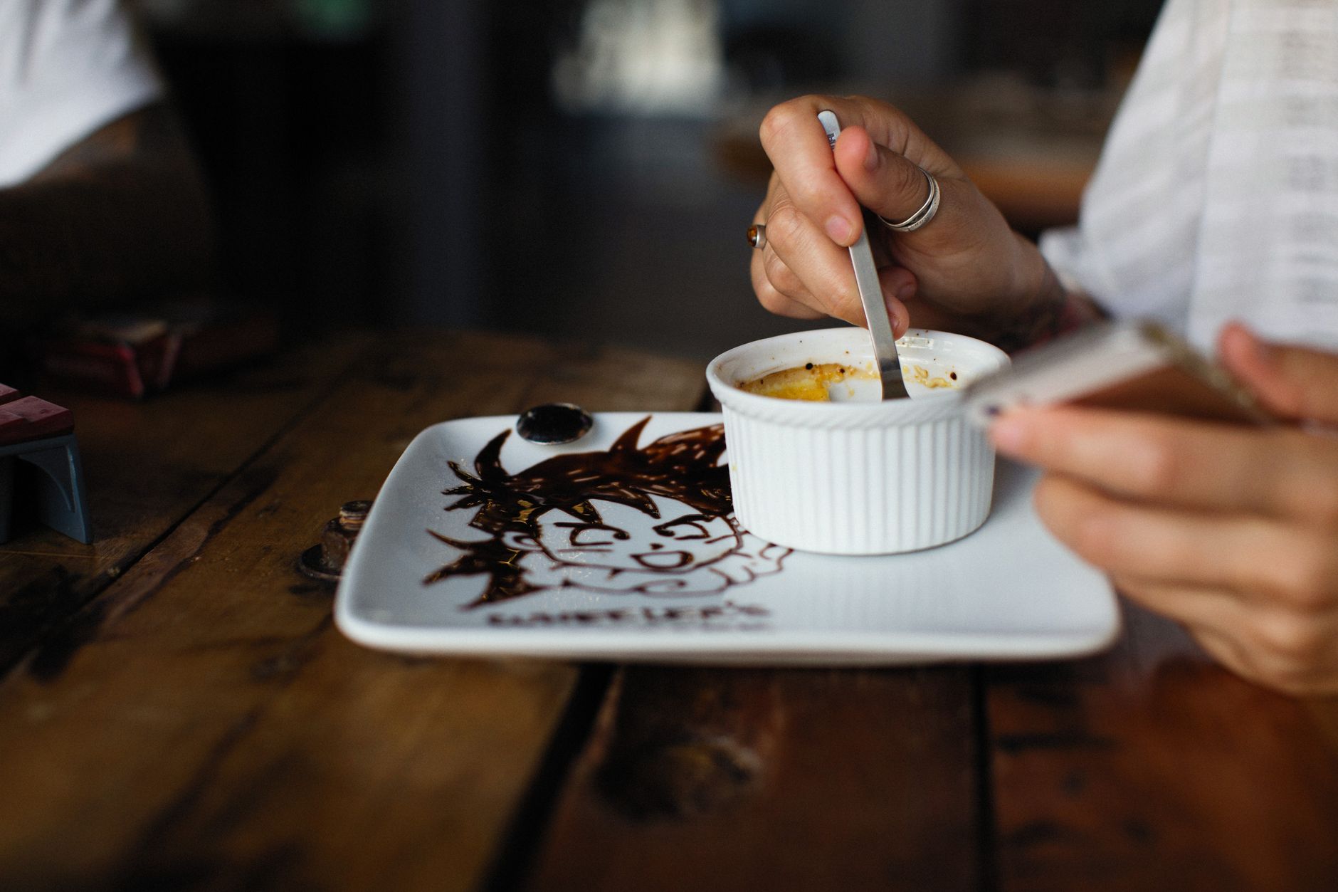 Vanilla custard topping with golden caramelized edges in Le Creuset ramekin