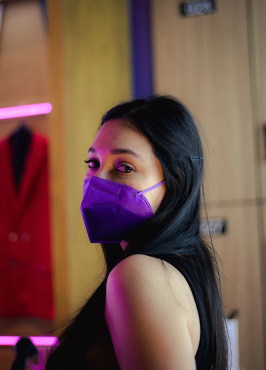 Portrait of a Woman with Dark Hair Wearing a Face Mask