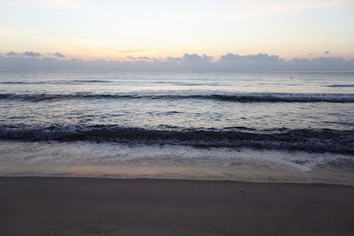 Foto profissional grátis de à beira-mar, água, alvorecer