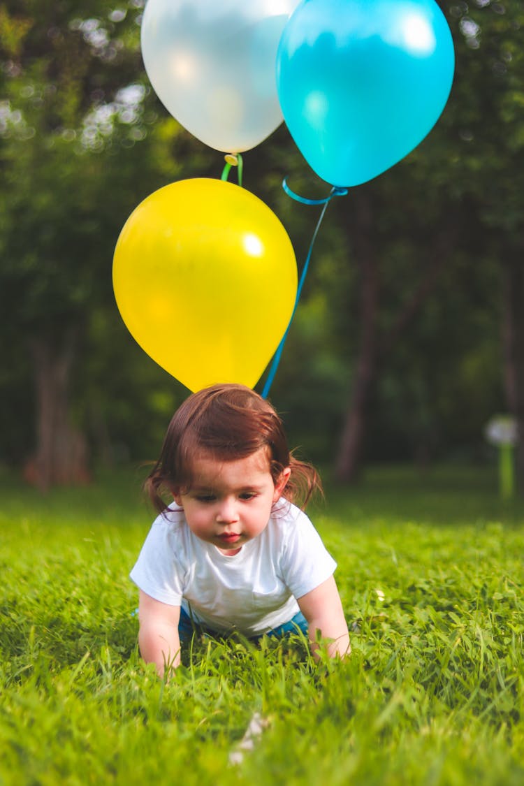 Photography Of A Baby On Grass