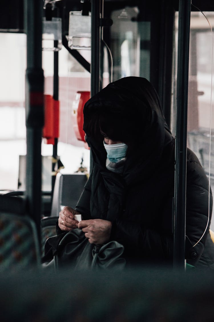 A Person Sitting Inside The Bus 