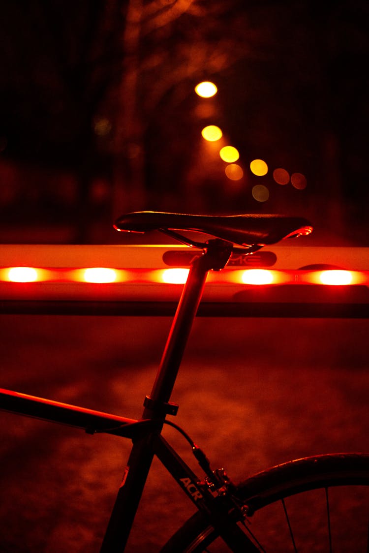 Bicycle Saddle Beside Light Railing