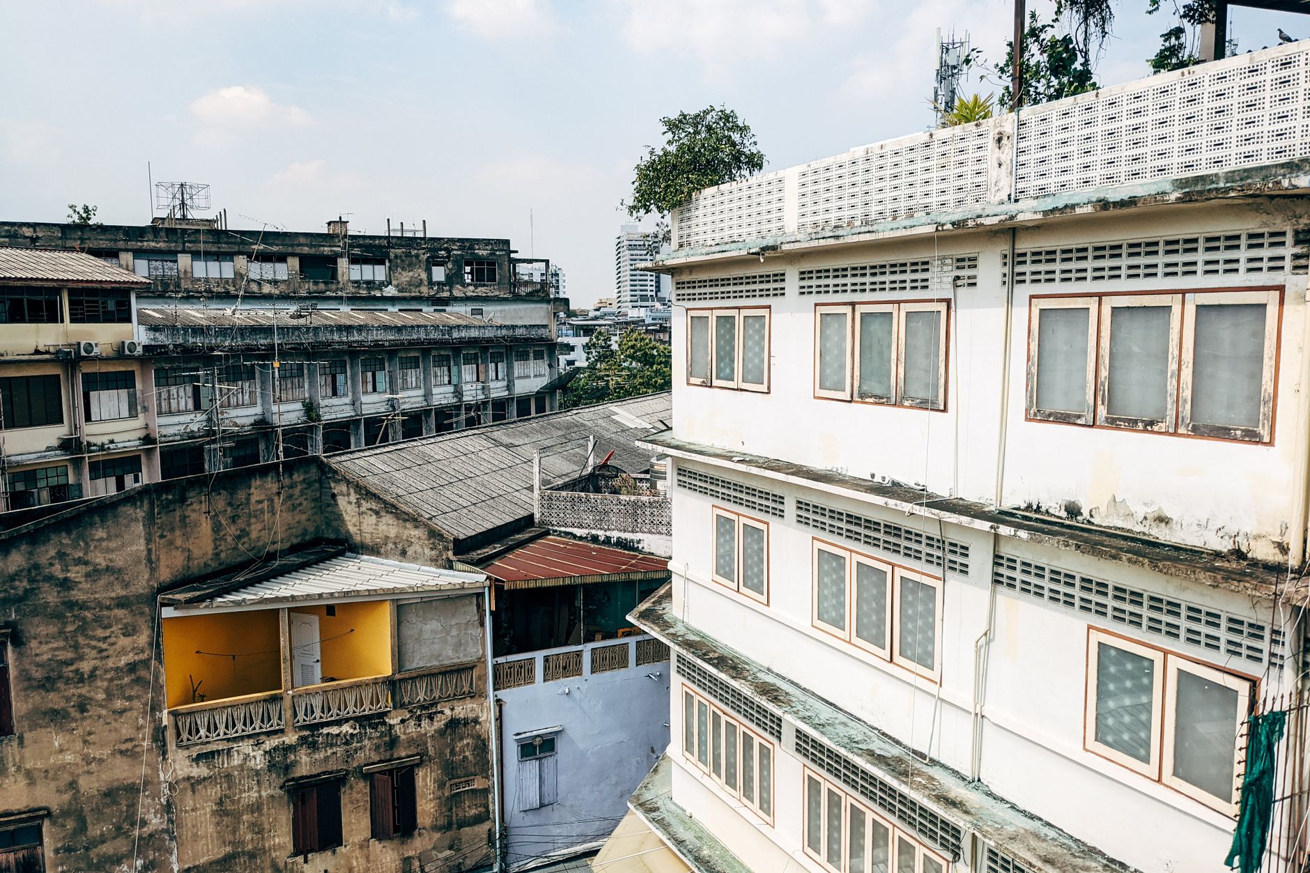 Ratchathewi BTS station with older shophouses and hotels along the street
