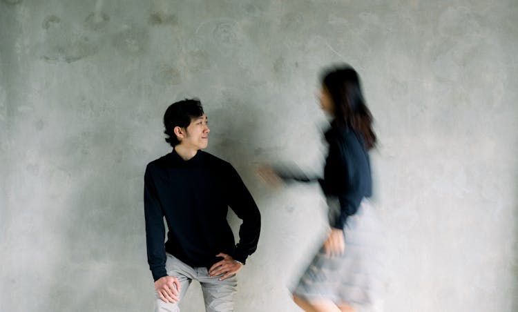 Young Man And Woman In Blurred Motion 