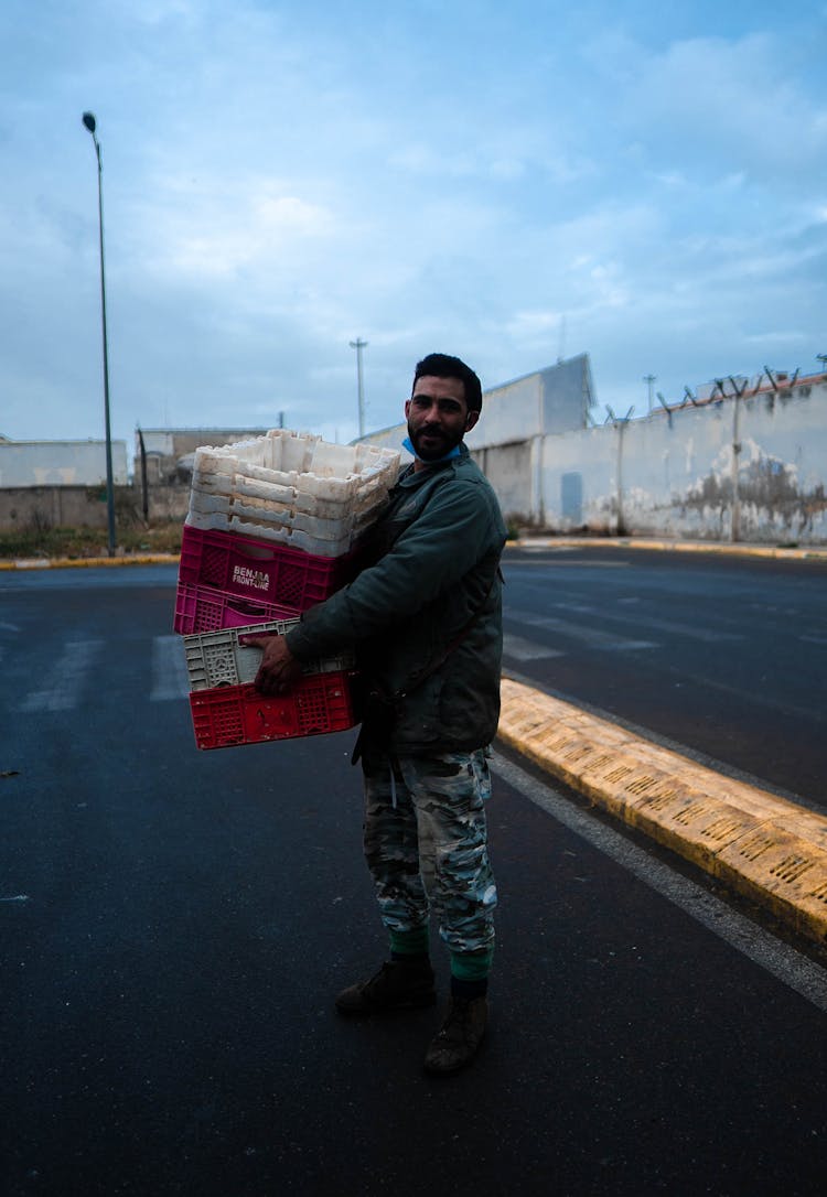 Man Carrying Empty Boxes 