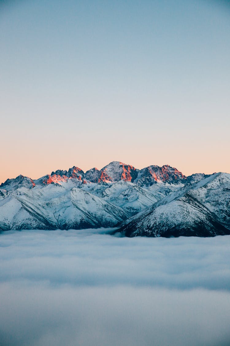 Clear Sky Over Snowcapped Mountains