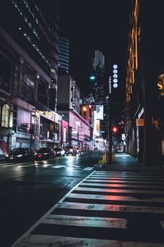 Vibrant urban night scene with lights and traffic in downtown Toronto.