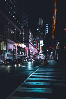 Discover the dynamic nightlife of Toronto's downtown with bright lights, bustling streets, and iconic architecture.
