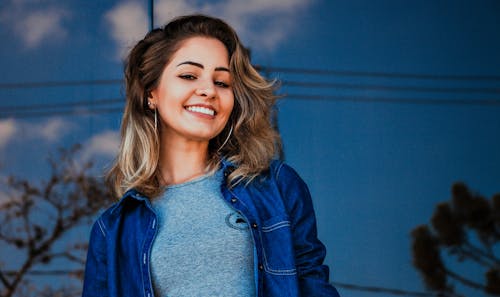 Free Woman Wearing Blue Shirt and Denim Jacket Stock Photo