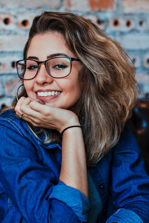 Free Closeup Photo of Smiling Woman Wearing Blue Denim Jacket Stock Photo