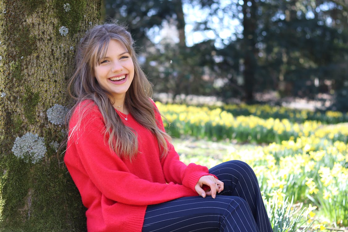 Smiling Woman Wearing Red Jacket