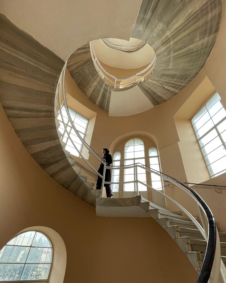 A Man Walking Up The Stairs