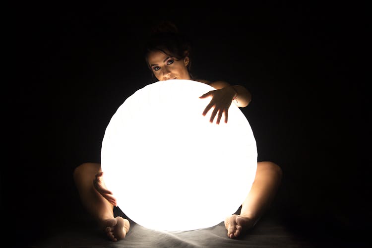 Woman Holds Led Large Ball