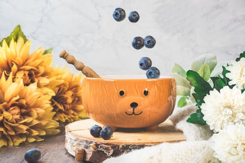 Brown Ceramic Bowl on Brown Wooden Chopping Board