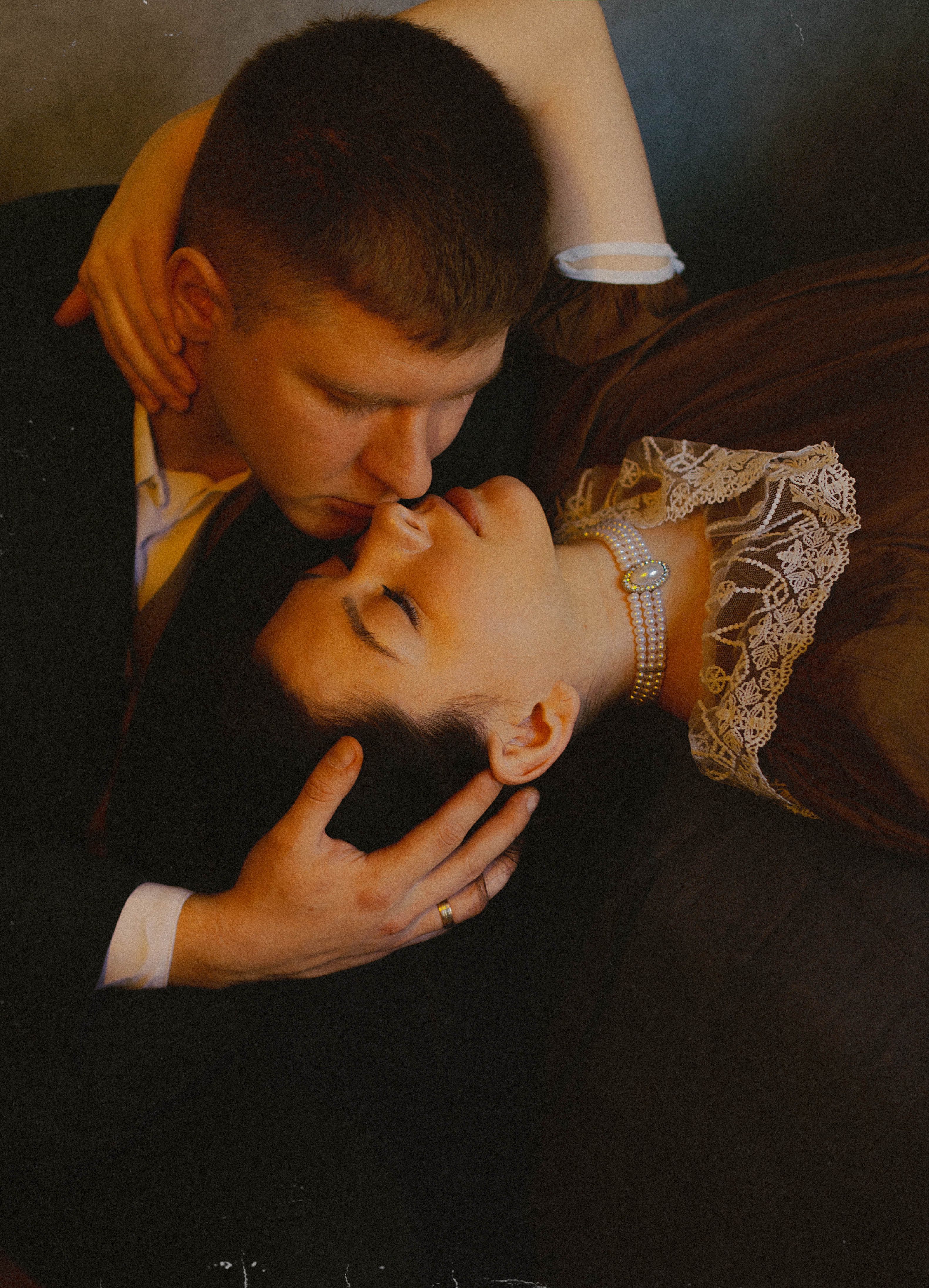 A romantic couple embracing lovingly in Saint Petersburg setting, evoking timeless affection.