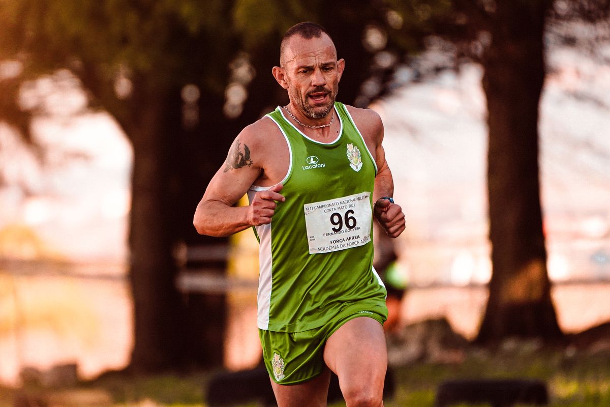 Male runner competing outdoors in performance sportswear