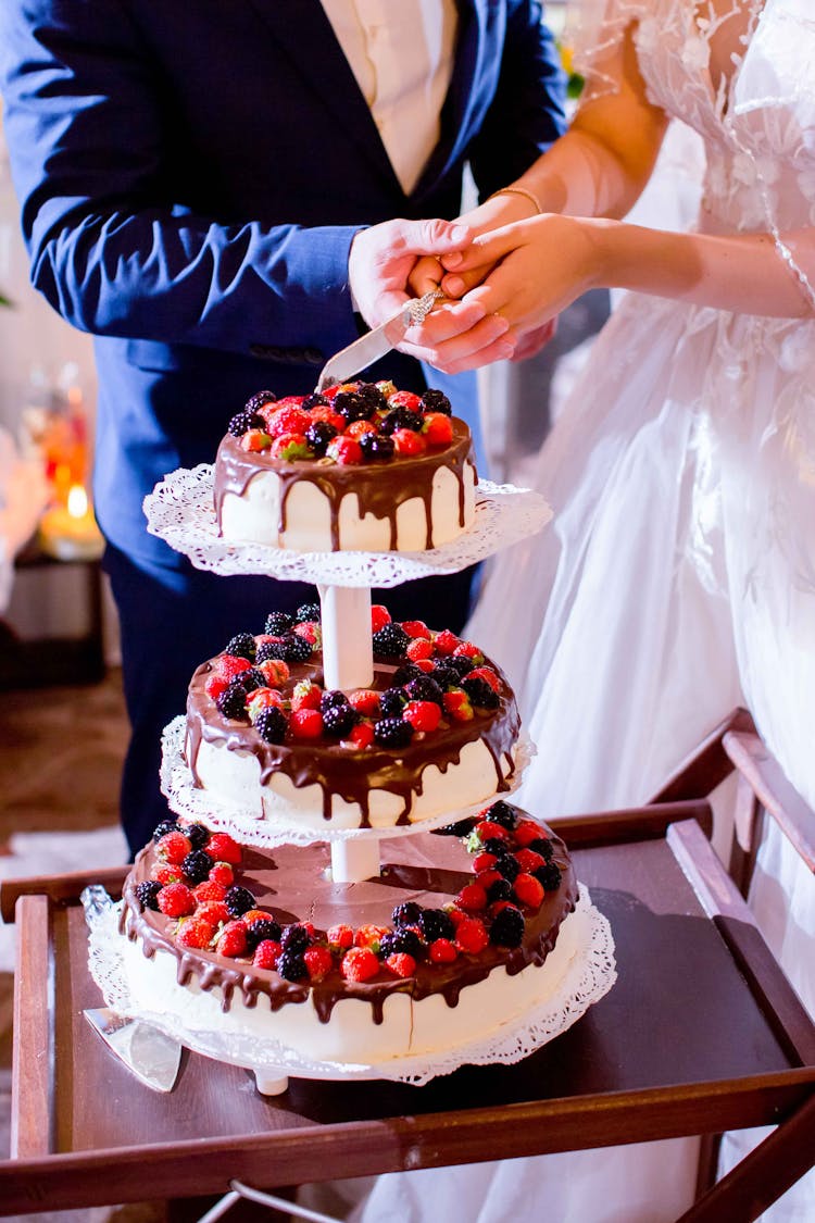 Bride And Groom Cutting Wedding Cake