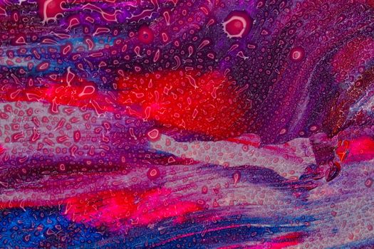 Colorful abstract art with vivid shades of red, purple, and blue textures.