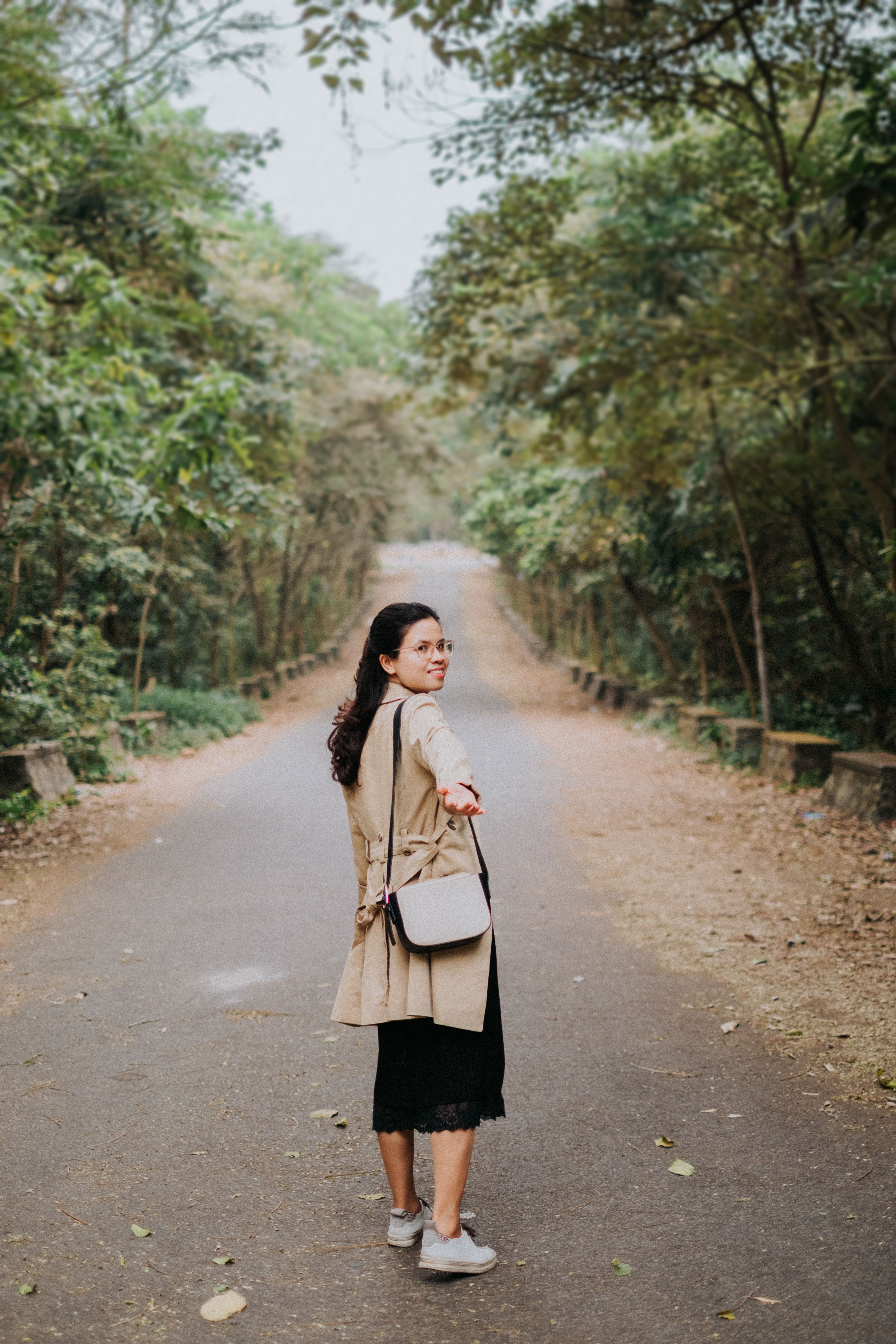 Woman in Black Coat Standing Near Bare Tree · Free Stock Photo