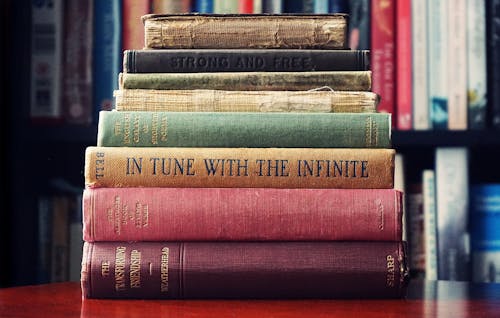 Pile of Assorted-title Book Lot Selective Focus Photographt