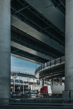 A complex urban highway with multiple flyovers and vehicle traffic, showcasing modern infrastructure.