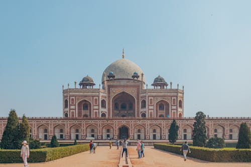 People on the Facade of the Humayun's Tomb in Delhi India