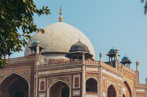 Free Stunning view of Humayun's Tomb showcasing its intricate architecture and clear blue sky. Stock Photo