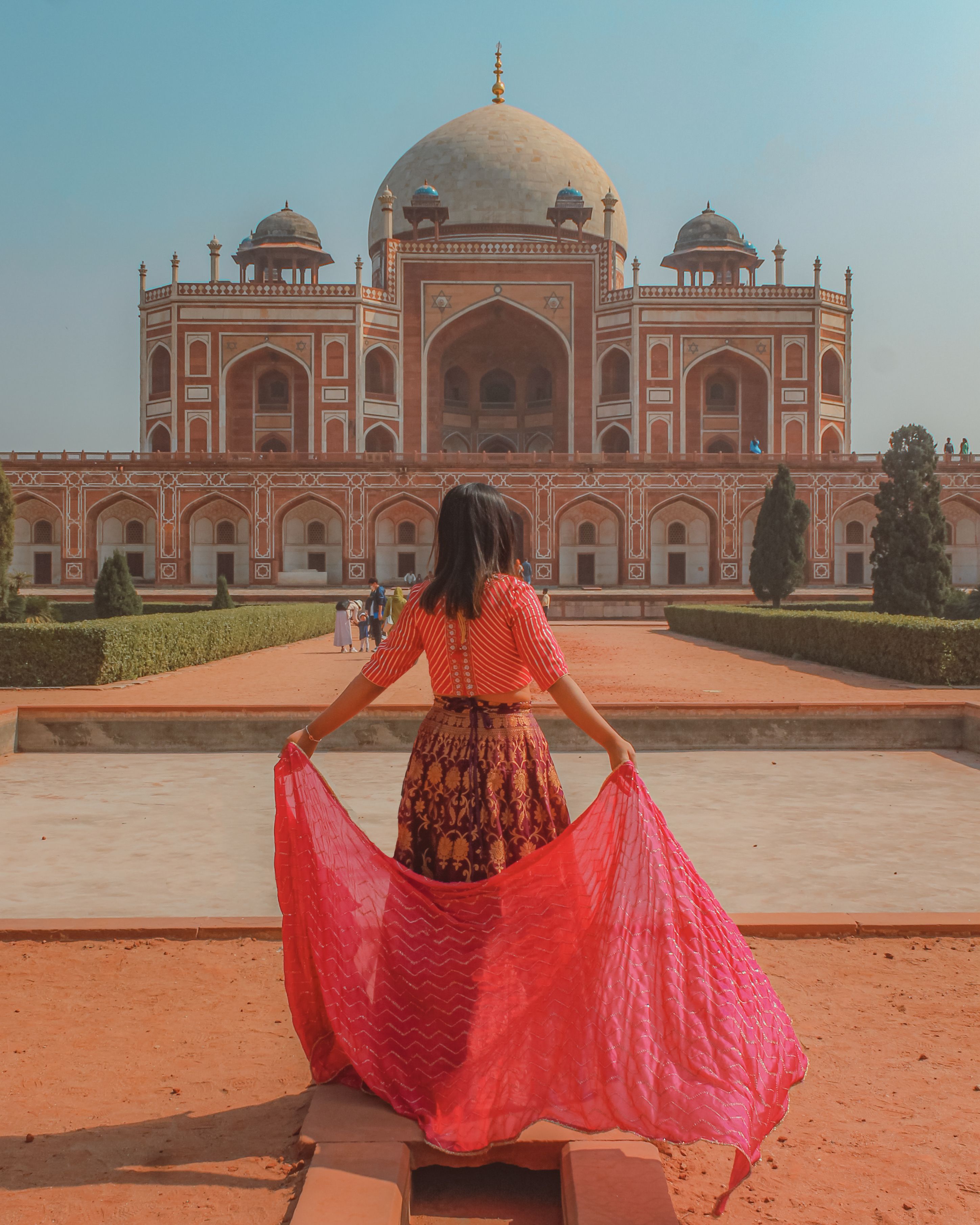 A Woman Standing in Front of the Humayun's Tomb · Free Stock Photo