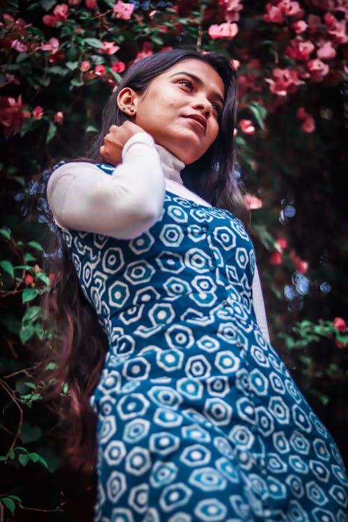 A Woman in Blue and White Dress