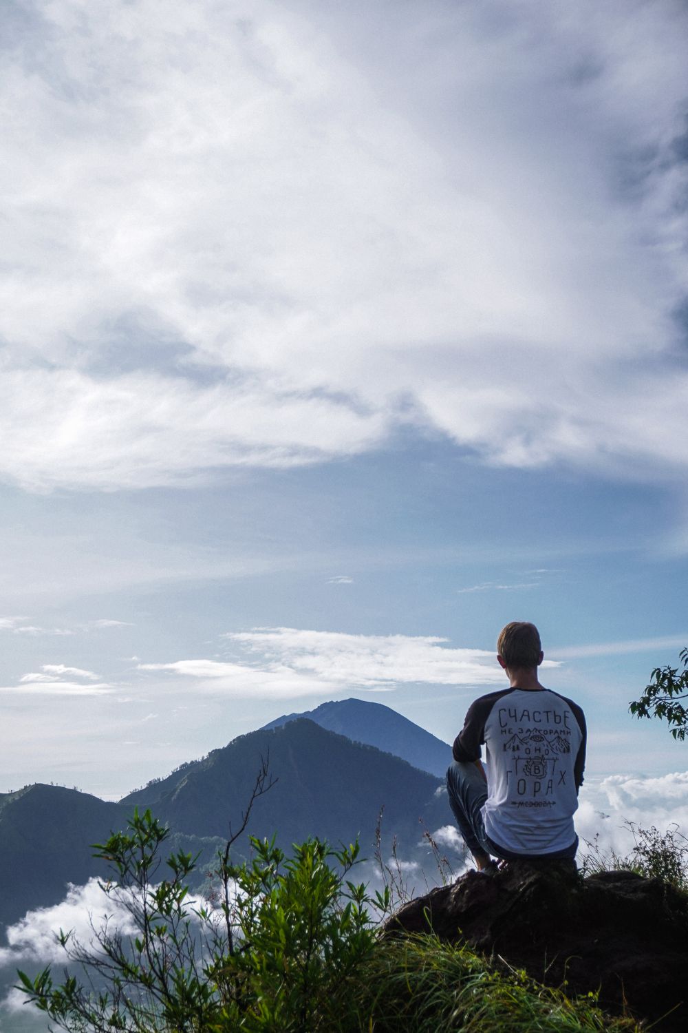 A Man Sitting on Top of the Mountain · Free Stock Photo