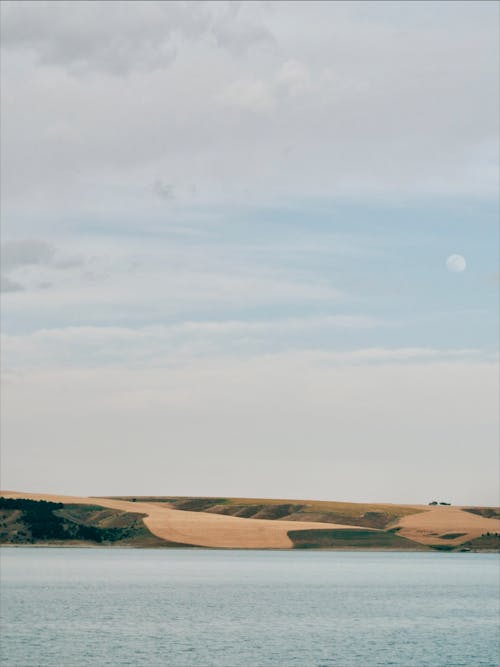 Kostenloses Stock Foto zu bewölkter himmel, grasfläche, kopie raum