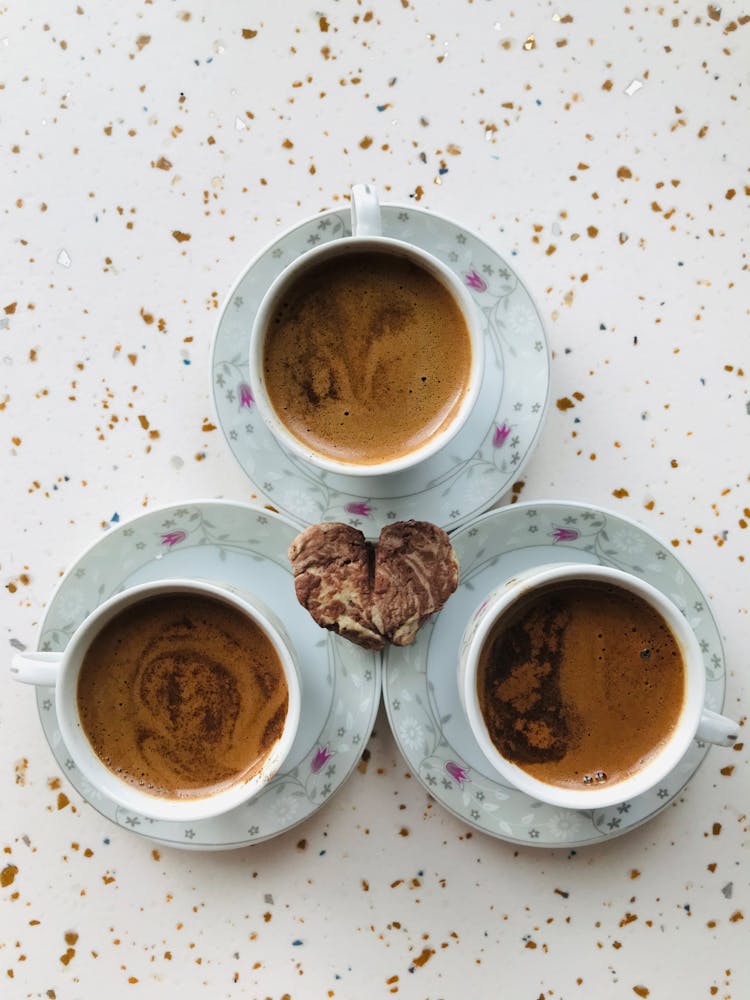 Heart Shape Bread And Cups Of Coffee